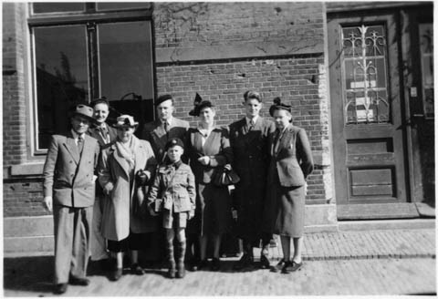 A group of Dutch immigrants in a farewell photograph before departing for Canada. Photograph taken at the Gronengen Appengendam train station, Holland.