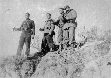 Four Finnish Canadian partisans returning to camp during the Spanish Civil War