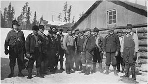 Loggers in front of a lumber camp