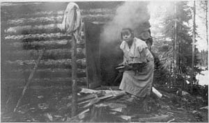 Anna Kauppi heating up the steambath at an Algoma lumber camp
