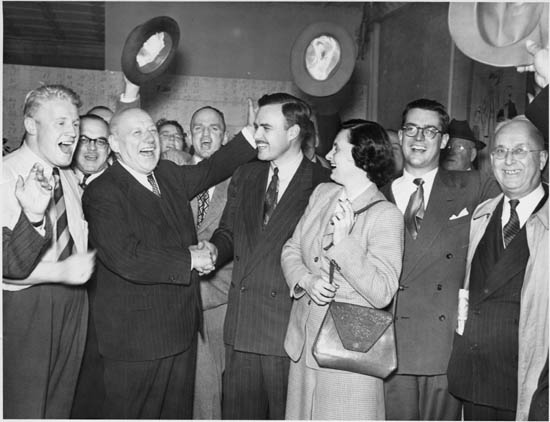A young John Robarts with supporters, London