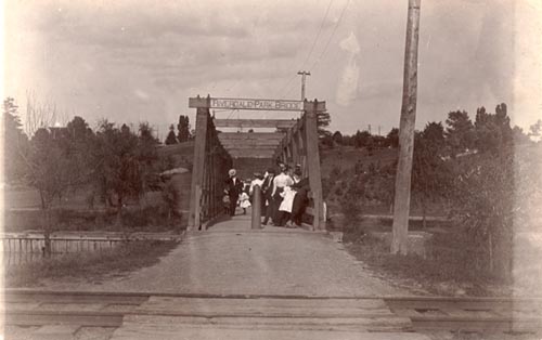 Historic photo from 1905 - Bridge over the Don River leading to the zoo. Childrens Hospital on hill to the right. Don Jail beyond that. in Riverdale park