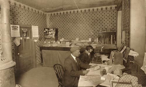 Mr. Fred H.A. Davis and Miss Anne Alexander, in his law office on Ramsay Street, Amherstburg