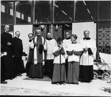 Priests and altar boys in front of a Czech community church