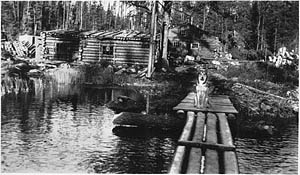 Lumber camp sauna with a lantern in the window, Perry A.C.R.