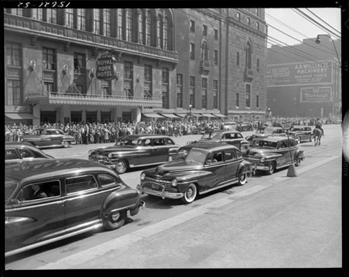 Historic photo from Monday, June 26, 1950 - Looking across Front St. to the crowds in front of the Royal York Hotel on the day of William Lyon Mackenzie King's funeral in Financial District